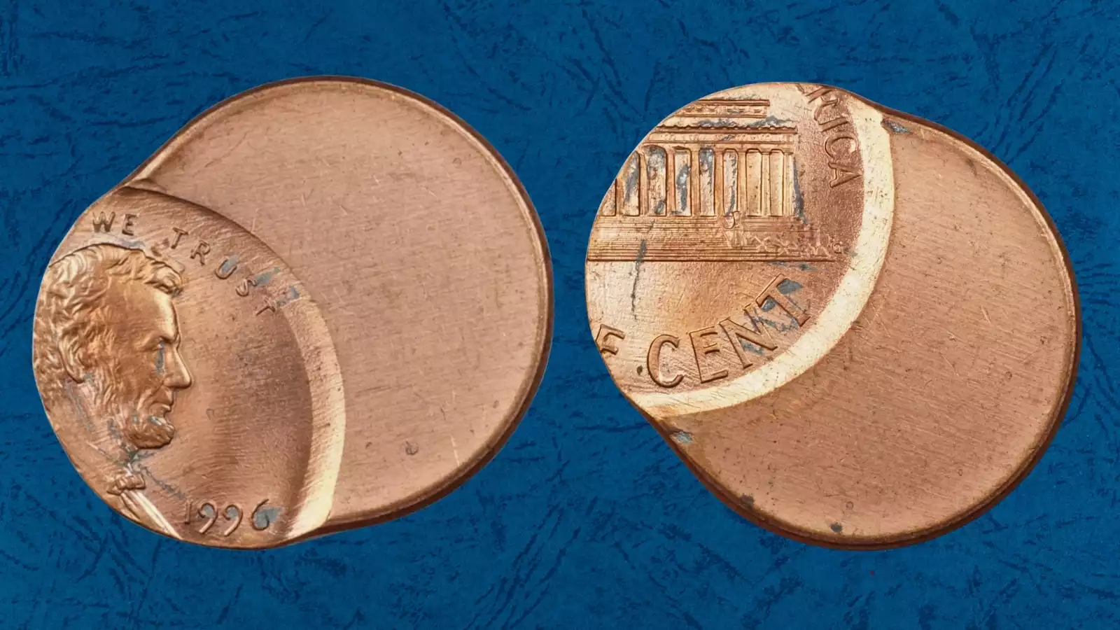 1996 penny off-center strike error showing design shifted with blank crescent planchet area visible